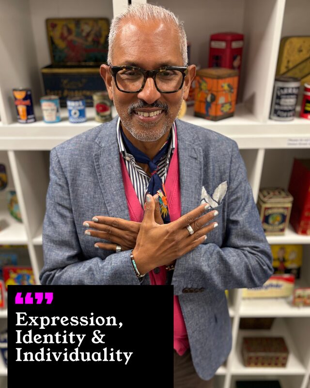 Ahmed Mohideen holding up his painted nails. His three words: Expression, Identity and Individuality.