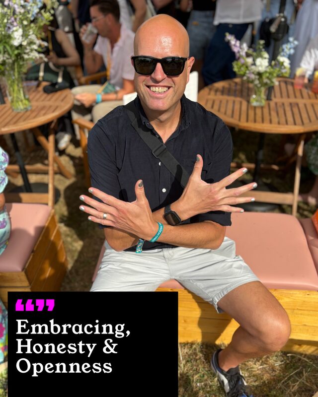 Andy Bell holding up his painted nails. His three words: Embracing, Honesty and Openness.
