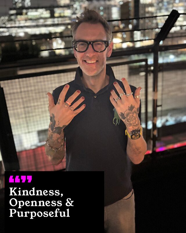 Ben Wickham holding up his painted nails. His three words: Kindness, Openness and Purposeful.