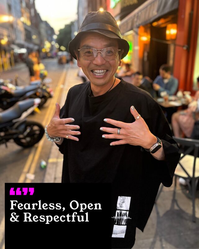 Chi Lo holding up his painted nails. His three words: Fearless, Open and Respectful.