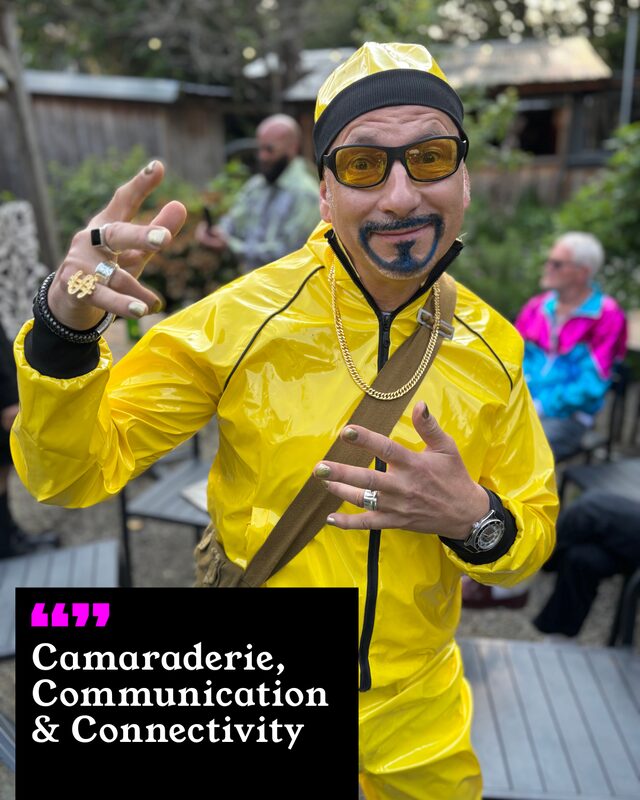 Chris Antoniades holding up his painted nails. His three words: Camaraderie, Communication and Connectivity.