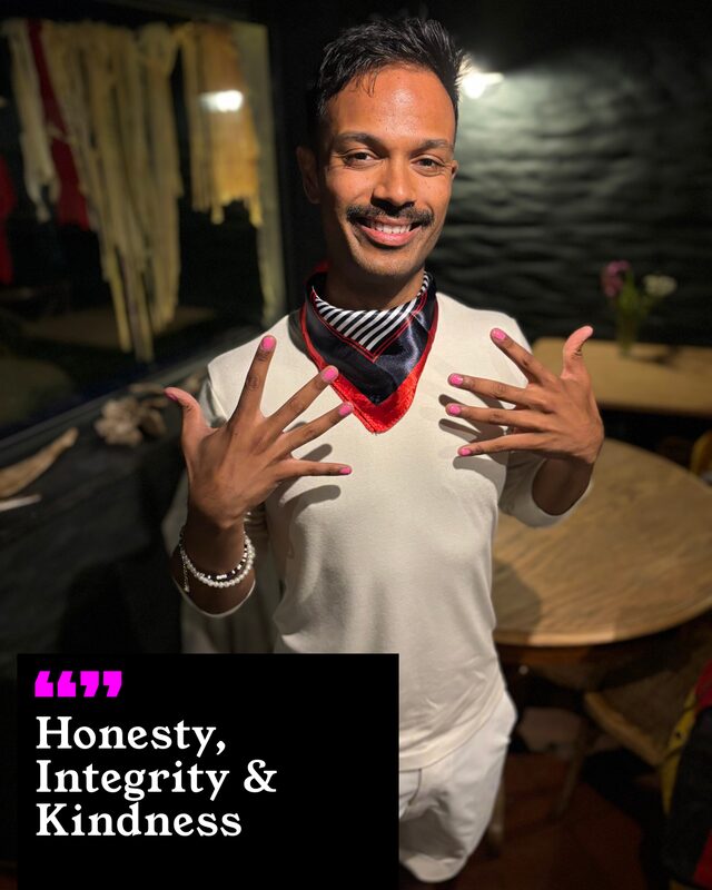 Deepesh Patel holding up his painted nails. His three words: Honesty, Integrity and Kindness.