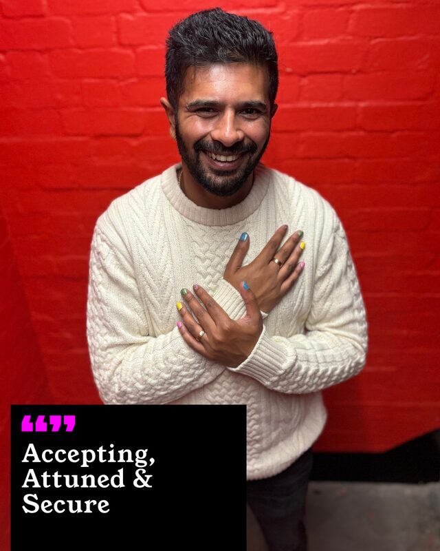 Dhiren Doshi-Smith holding up his painted nails. His three words: Accepting, Attuned and Secure.