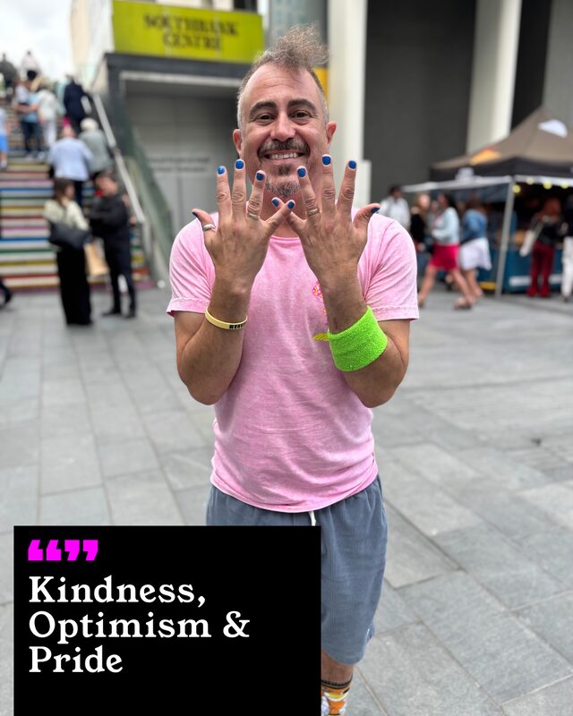 Faris Yakob holding up his painted nails. His three words: Kindness, Optimism and Pride.
