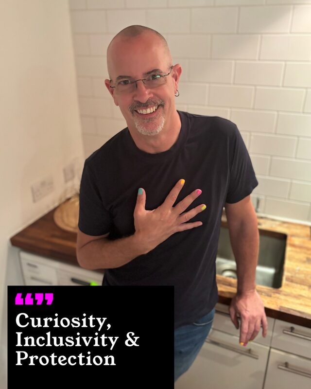 Felix Velarde holding up his painted nails. His three words: Curiosity, Inclusivity and Protection.