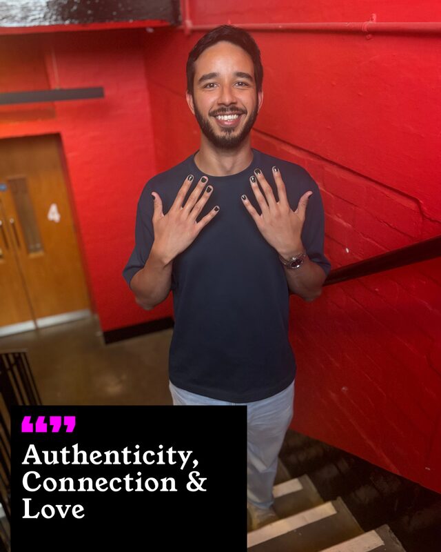 Hamish Noah holding up his painted nails. His three words: Authenticity, Connection and Love.