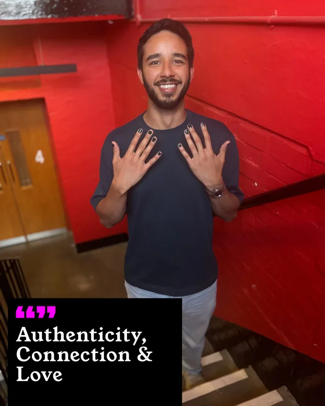 Hamish Noah holding up his painted nails. His three words: Authenticity, Connection and Love.