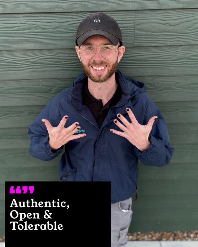 Jack Davies holding up his painted nails. His three words: Authentic, Open and Tolerable.
