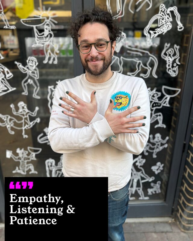 Jack Wallis holding up his painted nails. His three words: Empathy, Listening and Patience.
