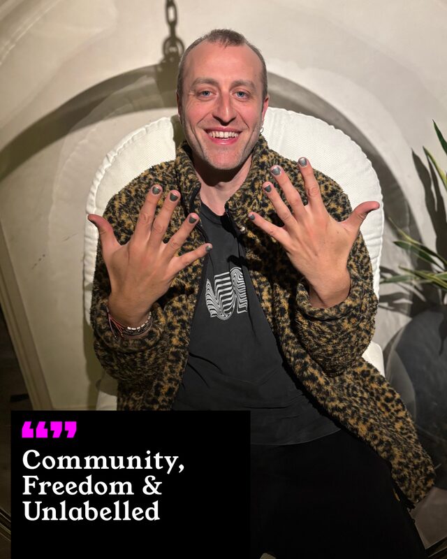 Jacopo Vana holding up his painted nails. His three words: Community, Freedom and Unlabelled.