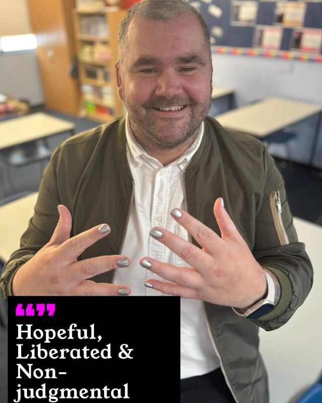 Liam Guest holding up his painted nails. His three words: Hopeful, Liberated and Non-judgmental.