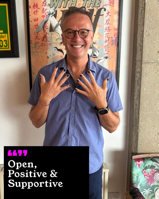 Mark Horne holding up his painted nails. His three words: Open, Positive and Supportive.