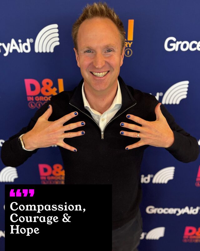 Matt Boulter holding up his painted nails. His three words: Compassion, Courage and Hope.