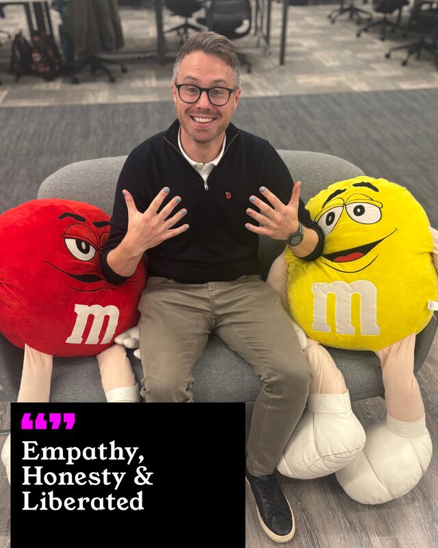 Matt Norgate holding up his painted nails. His three words: Empathy, Honesty and Liberated.