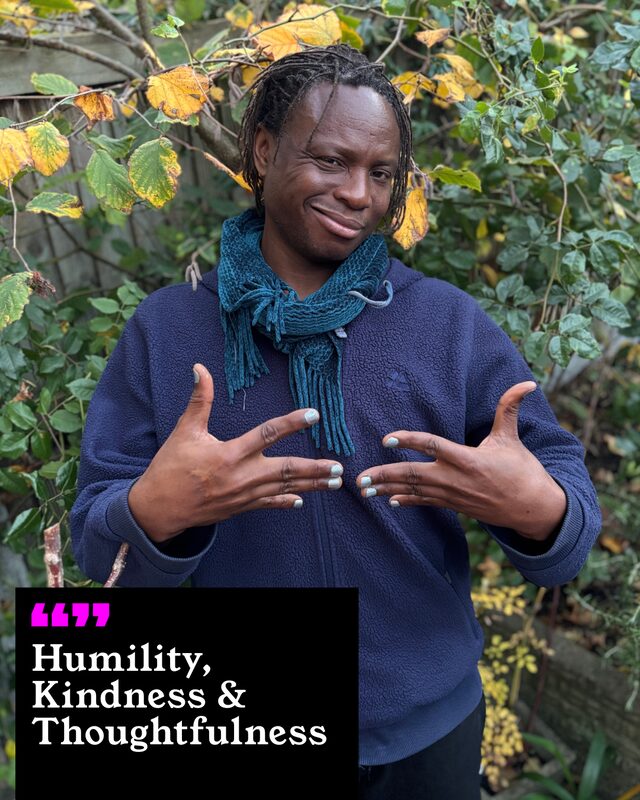 Ntukhuko Nzuza holding up his painted nails. His three words: Humility, Kindness and Thoughtfulness.