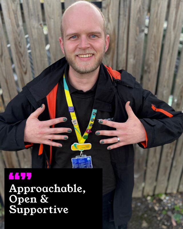 Oliver Hebdon holding up his painted nails. His three words: Approachable, Open and Supportive.