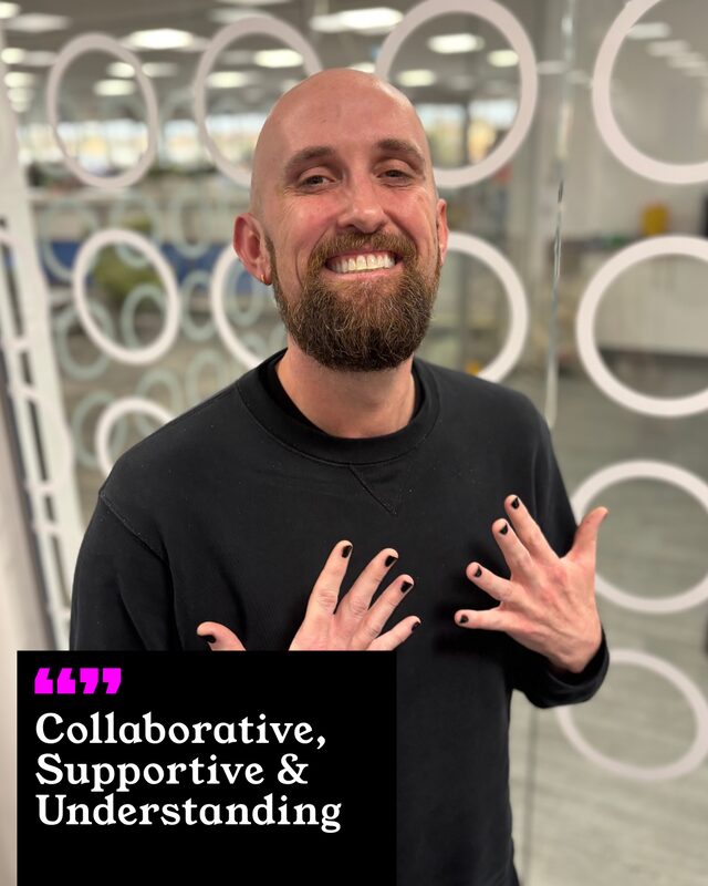 Patrick Garvin holding up his painted nails. His three words: Collaborative, Supportive and Understanding.