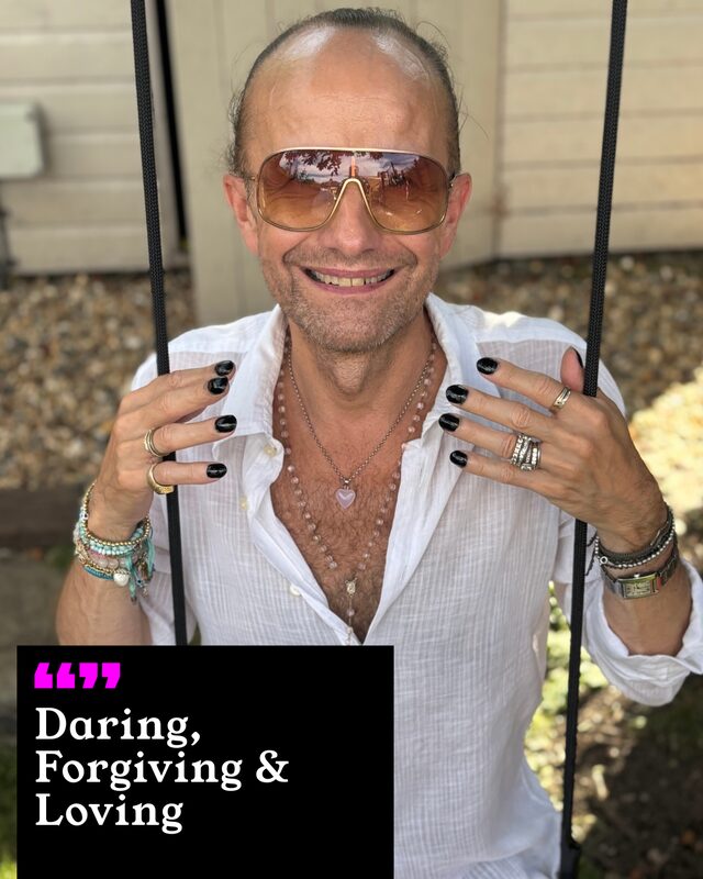 Philip Wrangle Sanders holding up his painted nails. His three words: Daring, Forgiving and Loving.