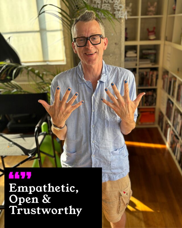 Rupert Cheswright holding up his painted nails. His three words: Empathetic, Open and Trustworthy.