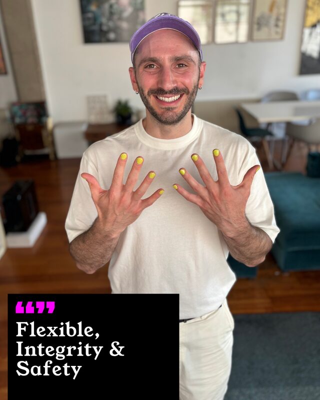 Sam Sylvester holding up his painted nails. His three words: Flexible, Integrity and Safety.