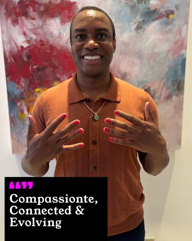 A participant holding up his painted nails. His three words: Compassionate, Connected and Evolving.