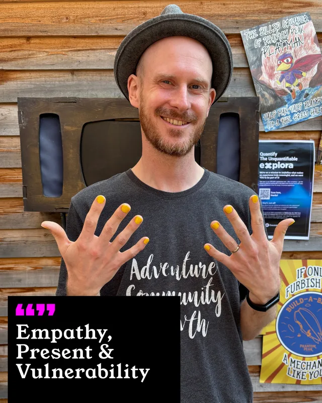 A participant holding up his painted nails. His three words: Empathy, Present and Vulnerability.