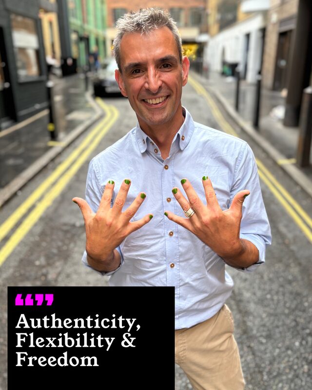 Simon Blake holding up his painted nails. His three words: Authenticity, Flexibility and Freedom.