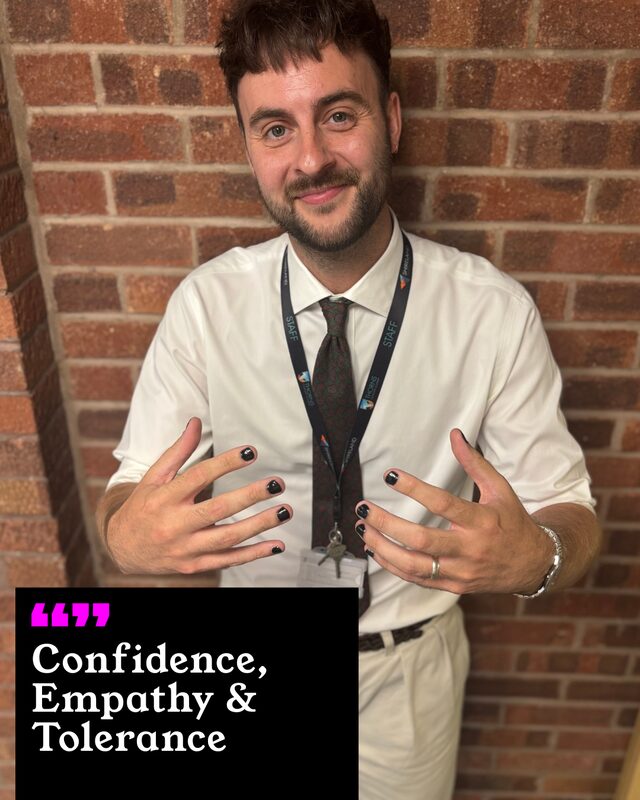Tom Pell holding up his painted nails. His three words: Confidence, Empathy and Tolerance.